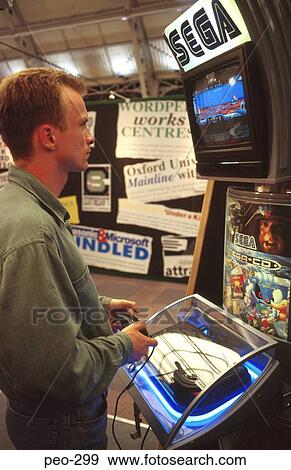 Stock Photo - Man Playing Sega Console Game. Fotosearch