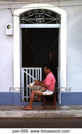 Man Reading Newspaper in House Doorway Panama City View Large Photo Image Stock Photo - Man Reading Newspaper in House Doorway Panama City. Fotosearch