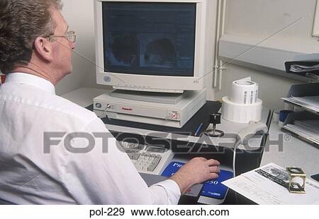 Man Using Computer UK View Large Photo Image Stock Photo - Man Using Computer UK. Fotosearch