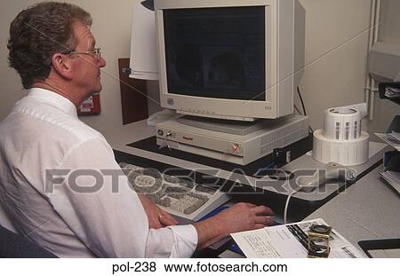 Man Using Computer UK View Large Photo Image Stock Photo - Man Using Computer UK. Fotosearch