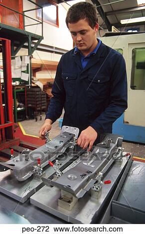 Man using Metal Clamp in Factory View Large Photo Image Stock Image - Man using Metal Clamp in Factory. Fotosearch