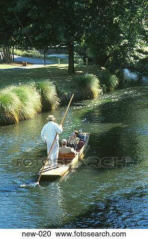 Stock Image - Man Using Punt Avon River Christchurch New Zealand. Fotosearch