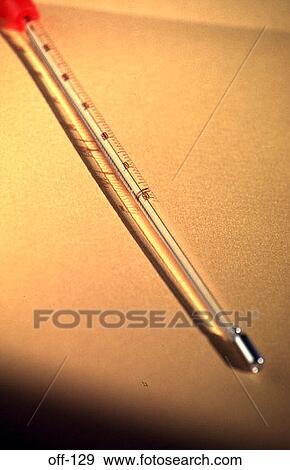 Medical Thermometer on a Yellow Background View Large Photo Image Stock Photo - Medical Thermometer on a Yellow Background. Fotosearch