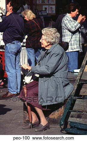 Old Woman Sitting in the Street UK View Large Photo Image Stock Image - Old Woman Sitting in the Street UK. Fotosearch