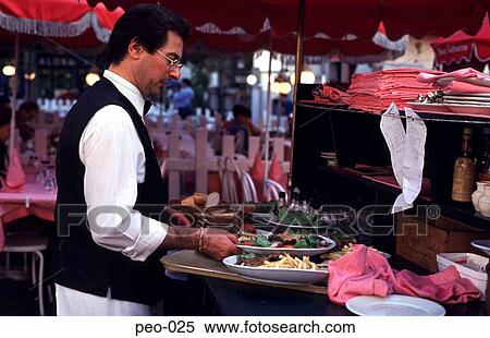 Stock Photography - Parisian Waiter Serving Food. Fotosearch