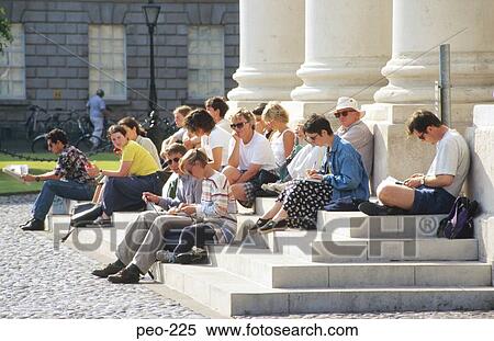 Stock Photography - People Relaxing on Steps Dublin Ireland. Fotosearch