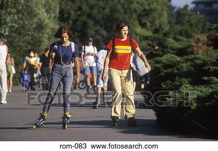 Stock Image - People Rollerblading in Herastau Park Romania. Fotosearch