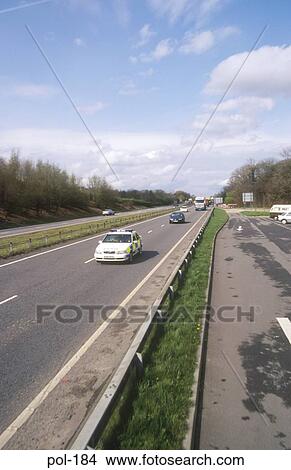 Police Patrol Car on Dual Carriageway UK View Large Photo Image Picture - Police Patrol Car on Dual Carriageway UK. Fotosearch