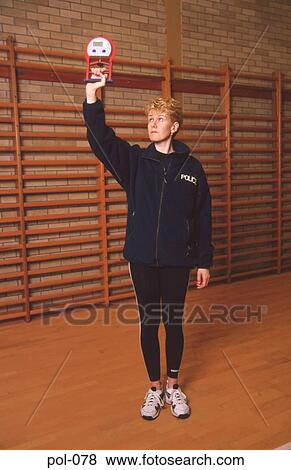 Stock Photo - Police PT Instructor Measuring Grip. Fotosearch