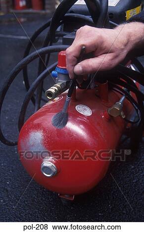 Policeman Dusting Compressor Receiver for Fingerprints UK View Large Photo Image Stock Photo - Policeman Dusting Compressor Receiver for Fingerprints UK. Fotosearch