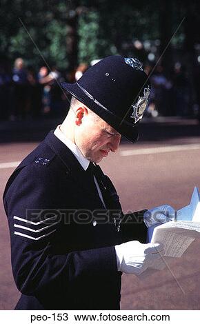 Policeman Studying Notes UK View Large Photo Image Stock Image - Policeman Studying Notes UK. Fotosearch