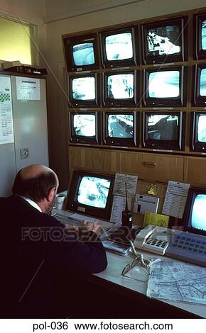 Policeman Viewing Security Camera Screens View Large Photo Image Stock Photograph - Policeman Viewing Security Camera Screens. Fotosearch