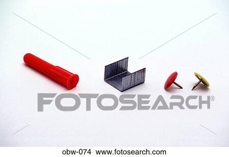 Red Plastic Rawlplug & Staples & Colour Drawing Pins View Large Photo Image Picture - Red Plastic Rawlplug & Staples & Colour Drawing Pins. Fotosearch