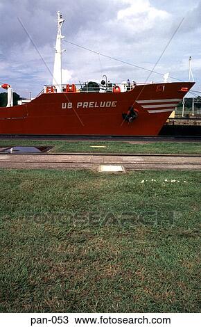 Stock Image - Red Transport Ship in Mirafrores Lock Panama Canal. Fotosearch
