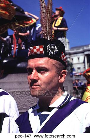 Scottish Man Wearing a Tartan Cap with Feathers View Large Photo Image Stock Photo - Scottish Man Wearing a Tartan Cap with Feathers. Fotosearch