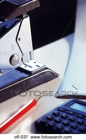Stapler and Other Office Equipment on Desk View Large Photo Image Stock Photo - Stapler and Other Office Equipment on Desk. Fotosearch