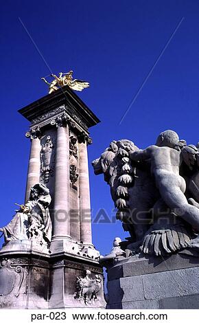 Stock Image - Statues on the Alexander III Bridge Paris France. Fotosearch