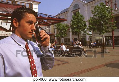 Store Detective Using Radio Handset View Large Photo Image Stock Photograph - Store Detective Using Radio Handset. Fotosearch