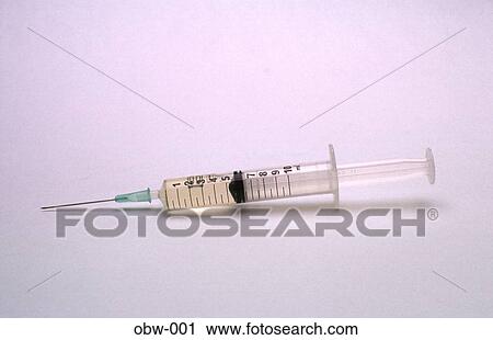 Stock Image - Syringe filled with Fluid. Fotosearch