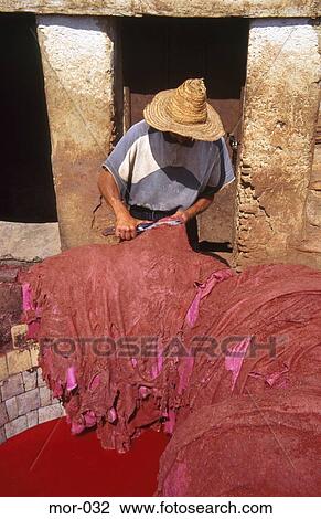 Tanner Scrapping Dyed Skin Fes Morocco View Large Photo Image Stock Image - Tanner Scrapping Dyed Skin Fes Morocco. Fotosearch