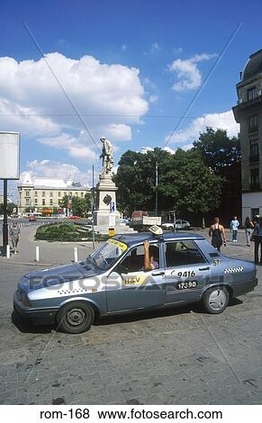 Taxi on the Piata Universitatii Bucharest Romania View Large Photo Image Stock Photo - Taxi on the Piata Universitatii Bucharest Romania. Fotosearch