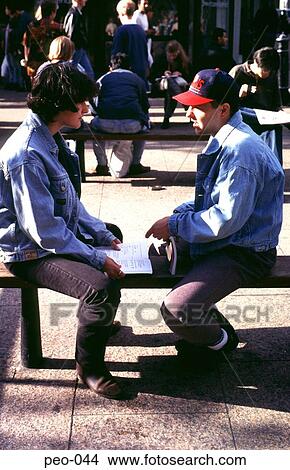 Picture - Teenagers Sitting on a Bench. Fotosearch