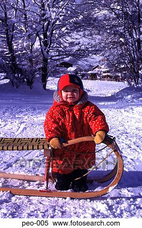 Toddler Holding Sledge in Snow View Large Photo Image Stock Photography - Toddler Holding Sledge in Snow. Fotosearch