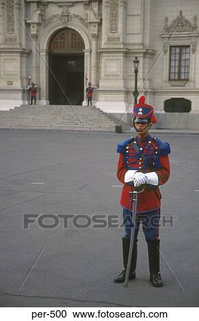 Stock Image - Traditionally Dressed Guard outside the Palacio de Gobierno Lima Peru. Fotosearch