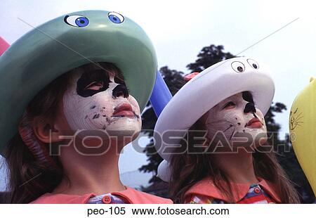 Twin Girls with Painted Faces Looking up UK View Large Photo Image Stock Photography - Twin Girls with Painted Faces Looking up UK. Fotosearch