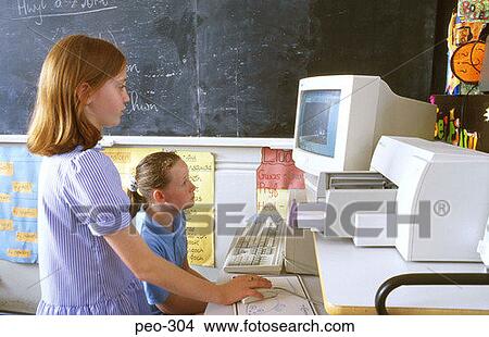 Two Girls Using Computer in Classroom View Large Photo Image Picture - Two Girls Using Computer in Classroom. Fotosearch