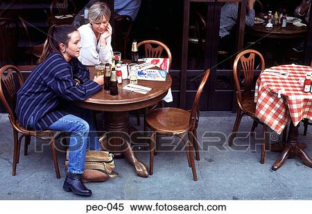 Stock Photography - Two Women Sitting in an Outside Cafe. Fotosearch