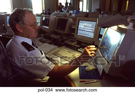Uniformed Police Man using Computer Touch Screen View Large Photo Image Picture - Uniformed Police Man using Computer Touch Screen. Fotosearch