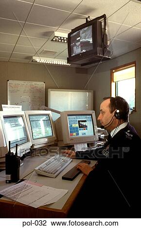 Uniformed Police Man using Telephone Headset View Large Photo Image Stock Image - Uniformed Police Man using Telephone Headset. Fotosearch