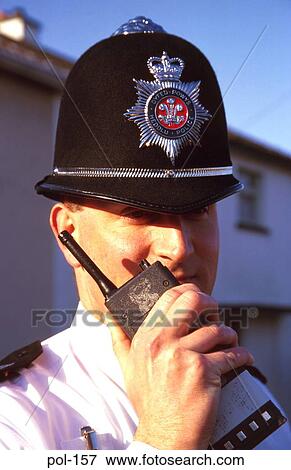 Uniformed Policeman using Radio View Large Photo Image Stock Photo - Uniformed Policeman using Radio. Fotosearch