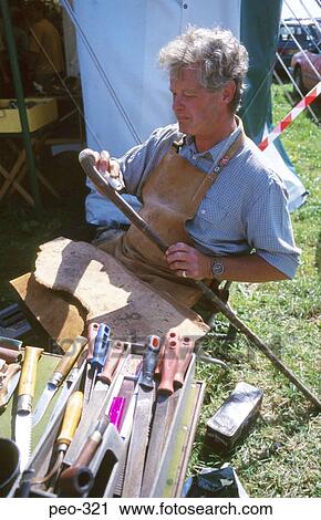 Stock Image - Walking Stick Maker at Country Fair. Fotosearch