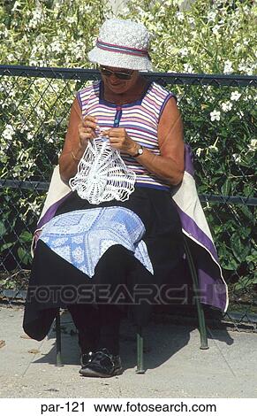 Woman Crocheting on Pavement Paris France View Large Photo Image Stock Image - Woman Crocheting on Pavement Paris France. Fotosearch
