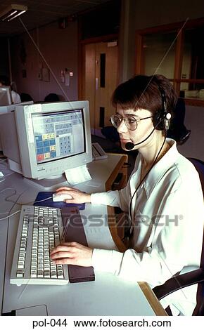 Woman in Police Office using Telephone Headset View Large Photo Image Picture - Woman in Police Office using Telephone Headset. Fotosearch