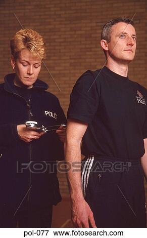 Stock Photo - Woman Measuring Man With Callipers. Fotosearch