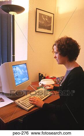 Woman Using Computer in Office View Large Photo Image Stock Photograph - Woman Using Computer in Office. Fotosearch