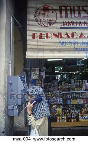 Woman Using Pay Phone Little India Kuala Lumpur Malaysia View Large Photo Image Picture - Woman Using Pay Phone Little India Kuala Lumpur Malaysia. Fotosearch