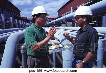 Workers in a Refinery Talking View Large Photo Image Stock Photograph - Workers in a Refinery Talking. Fotosearch