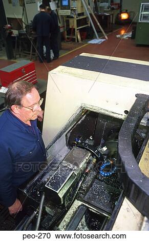 Stock Image - Workman at Lathe. Fotosearch
