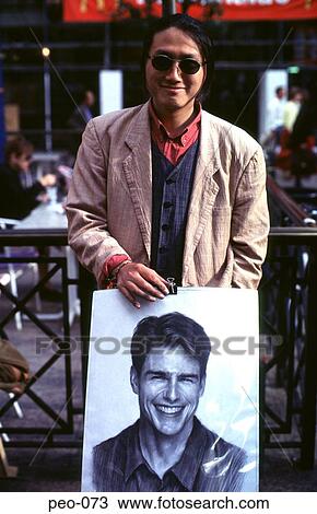 Stock Image - Young Artist Displaying Sketches. Fotosearch
