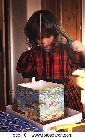 Young Girl in Party Dress Playing Fishing Game UK View Large Photo Image Stock Image - Young Girl in Party Dress Playing Fishing Game UK. Fotosearch