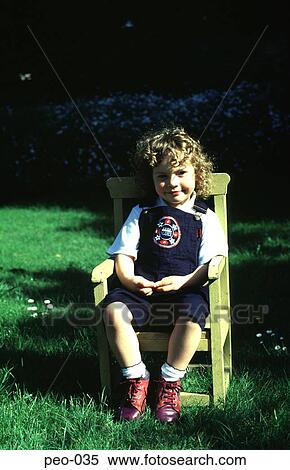 Stock Photography - Young Girl Sitting in a Chair. Fotosearch