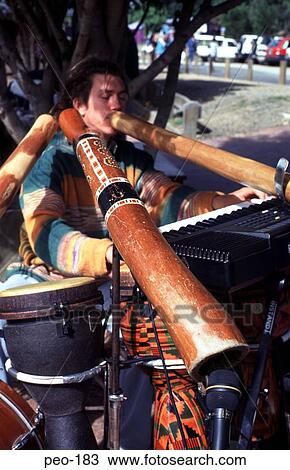 Young Man Playing Didgeridoos in a Band View Large Photo Image Stock Image - Young Man Playing Didgeridoos in a Band. Fotosearch