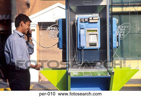 Young Man Using Public Telephone Peru View Large Photo Image Stock Image - Young Man Using Public Telephone Peru. Fotosearch