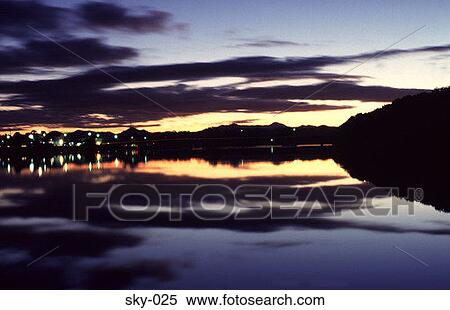 Stock Photography - Altostratus Reflected in Water at Dusk. Fotosearch