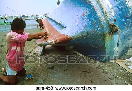 Stock Photo - Boat Being Repaired on Shore Musnie Ecuador. Fotosearch