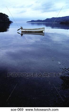 Stock Photo - Boat on Calm Water UK. Fotosearch